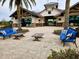 Spacious patio area with comfortable seating and landscaping at 7486 Divot Loop # 7486, Bradenton, FL 34202