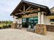 Community building exterior with rocking chairs and stone accents at 7486 Divot Loop # 7486, Bradenton, FL 34202
