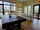 Game room featuring a pool table and seating area with large windows at 7486 Divot Loop # 7486, Bradenton, FL 34202