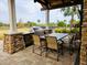 Outdoor grilling station with seating for comfortable dining at 7486 Divot Loop # 7486, Bradenton, FL 34202