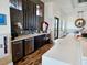 Modern kitchenette with stainless steel appliances and white cabinets at 7486 Divot Loop # 7486, Bradenton, FL 34202