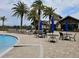 Relaxing pool deck with lounge chairs and patio tables for sunbathing and socializing at 7486 Divot Loop # 7486, Bradenton, FL 34202