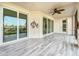 Spacious screened porch with tile flooring and sliding glass doors at 7486 Divot Loop # 7486, Bradenton, FL 34202