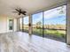Peaceful screened porch with wood-look tile flooring and golf course views at 7486 Divot Loop # 7486, Bradenton, FL 34202