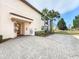 Private entrance with brick pavers and tropical landscaping at 7486 Divot Loop # 7486, Bradenton, FL 34202