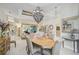 Formal dining room with an oval table and chandelier at 7503 Eaton Ct, University Park, FL 34201