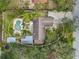 An aerial view showcasing a single-Gathering home with a pool and detached workshop at 7612 27Th W Ave, Bradenton, FL 34209