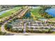 Aerial view of community tennis courts and residential homes at 7911 Grand Estuary Trl # 204, Bradenton, FL 34212