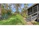 Landscaped backyard with lush greenery and a spacious lawn at 7938 Pinegrove Ct # 12, Sarasota, FL 34238