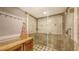 Clean bathroom with a walk in shower and linen storage at 7938 Pinegrove Ct # 12, Sarasota, FL 34238
