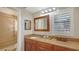 Elegant bathroom with double vanity, granite countertop, and walk-in shower at 7938 Pinegrove Ct # 12, Sarasota, FL 34238