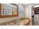 Modern bathroom with double vanity, granite countertop and walk-in closet at 7938 Pinegrove Ct # 12, Sarasota, FL 34238