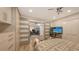 Main bedroom with sliding barn doors leading to an office at 7938 Pinegrove Ct # 12, Sarasota, FL 34238