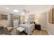 Cozy bedroom with skylights, ceiling fan, and built-in shelving at 7938 Pinegrove Ct # 12, Sarasota, FL 34238