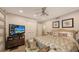 Bright bedroom featuring a large bed and plenty of closet space at 7938 Pinegrove Ct # 12, Sarasota, FL 34238