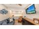 Cozy den with comfortable seating and built-in cabinetry at 7938 Pinegrove Ct # 12, Sarasota, FL 34238