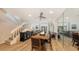 Spacious dining area with a rustic wood table and hardwood floors at 7938 Pinegrove Ct # 12, Sarasota, FL 34238