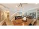 Open dining room with hardwood floors and view of living area at 7938 Pinegrove Ct # 12, Sarasota, FL 34238