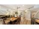 Bright dining room with large mirror reflecting the space at 7938 Pinegrove Ct # 12, Sarasota, FL 34238