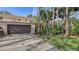 Exterior view of condo showing garage and landscaping at 7938 Pinegrove Ct # 12, Sarasota, FL 34238