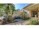 Condo entrance with patio and well-maintained landscaping at 7938 Pinegrove Ct # 12, Sarasota, FL 34238
