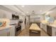 Updated kitchen boasts stainless steel appliances and a large island with butcher block top at 7938 Pinegrove Ct # 12, Sarasota, FL 34238