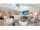 Open concept living room with high ceilings, fireplace, and loft area at 7938 Pinegrove Ct # 12, Sarasota, FL 34238