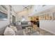 L-shaped sectional sofa anchors this living room with high ceilings and views to dining area at 7938 Pinegrove Ct # 12, Sarasota, FL 34238