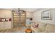 Relaxing office area with a sofa and built-in shelving at 7938 Pinegrove Ct # 12, Sarasota, FL 34238