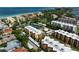 Aerial view of condo building with ocean and community views at 8773 Midnight Pass Rd # 205G, Sarasota, FL 34242