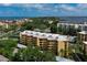 Aerial view showcasing condo building and its surrounding environment at 8773 Midnight Pass Rd # 205G, Sarasota, FL 34242