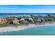 Aerial view of beachfront property, showcasing the beach and ocean at 8773 Midnight Pass Rd # 205G, Sarasota, FL 34242