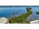 Aerial view of waterfront property with dock at 8773 Midnight Pass Rd # 205G, Sarasota, FL 34242