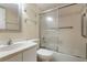 Clean bathroom, bathtub, shower, and glass enclosure at 8773 Midnight Pass Rd # 205G, Sarasota, FL 34242