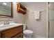 Clean bathroom with toilet and shower at 8773 Midnight Pass Rd # 205G, Sarasota, FL 34242