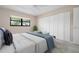 Well-lit bedroom with a comfortable bed and ample closet space at 8773 Midnight Pass Rd # 205G, Sarasota, FL 34242
