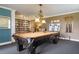 Billiards room with pool table and bookcases at 8773 Midnight Pass Rd # 205G, Sarasota, FL 34242