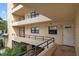 Exterior view of condo building showing hallways and entryways at 8773 Midnight Pass Rd # 205G, Sarasota, FL 34242