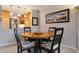 Dining area with round table and four chairs at 8773 Midnight Pass Rd # 205G, Sarasota, FL 34242