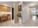 Bright and airy entryway with built-in storage and wood flooring at 8773 Midnight Pass Rd # 205G, Sarasota, FL 34242