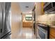 Updated kitchen with granite countertops and stainless steel appliances at 8773 Midnight Pass Rd # 205G, Sarasota, FL 34242