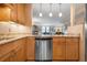 Kitchen with light wood cabinets and granite countertops at 8773 Midnight Pass Rd # 205G, Sarasota, FL 34242