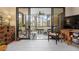 Bright living room with access to a screened balcony at 8773 Midnight Pass Rd # 205G, Sarasota, FL 34242