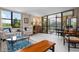 Spacious living room with access to balcony and water views at 8773 Midnight Pass Rd # 205G, Sarasota, FL 34242