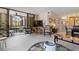 Open living area with view of balcony and dining area at 8773 Midnight Pass Rd # 205G, Sarasota, FL 34242