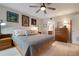 King-size bed in a well lit main bedroom with ensuite bathroom access at 8773 Midnight Pass Rd # 205G, Sarasota, FL 34242