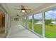 Spacious sunroom with lake view and tile flooring at 8812 46Th W Ave, Bradenton, FL 34210