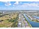Aerial view of a community near a lake and conservation area at 9085 Bernini Pl, Sarasota, FL 34240