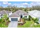 Luxury home with dark gray roof and nicely landscaped yard at 9085 Bernini Pl, Sarasota, FL 34240