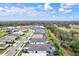 Aerial view of a residential neighborhood near a lake and conservation at 9085 Bernini Pl, Sarasota, FL 34240